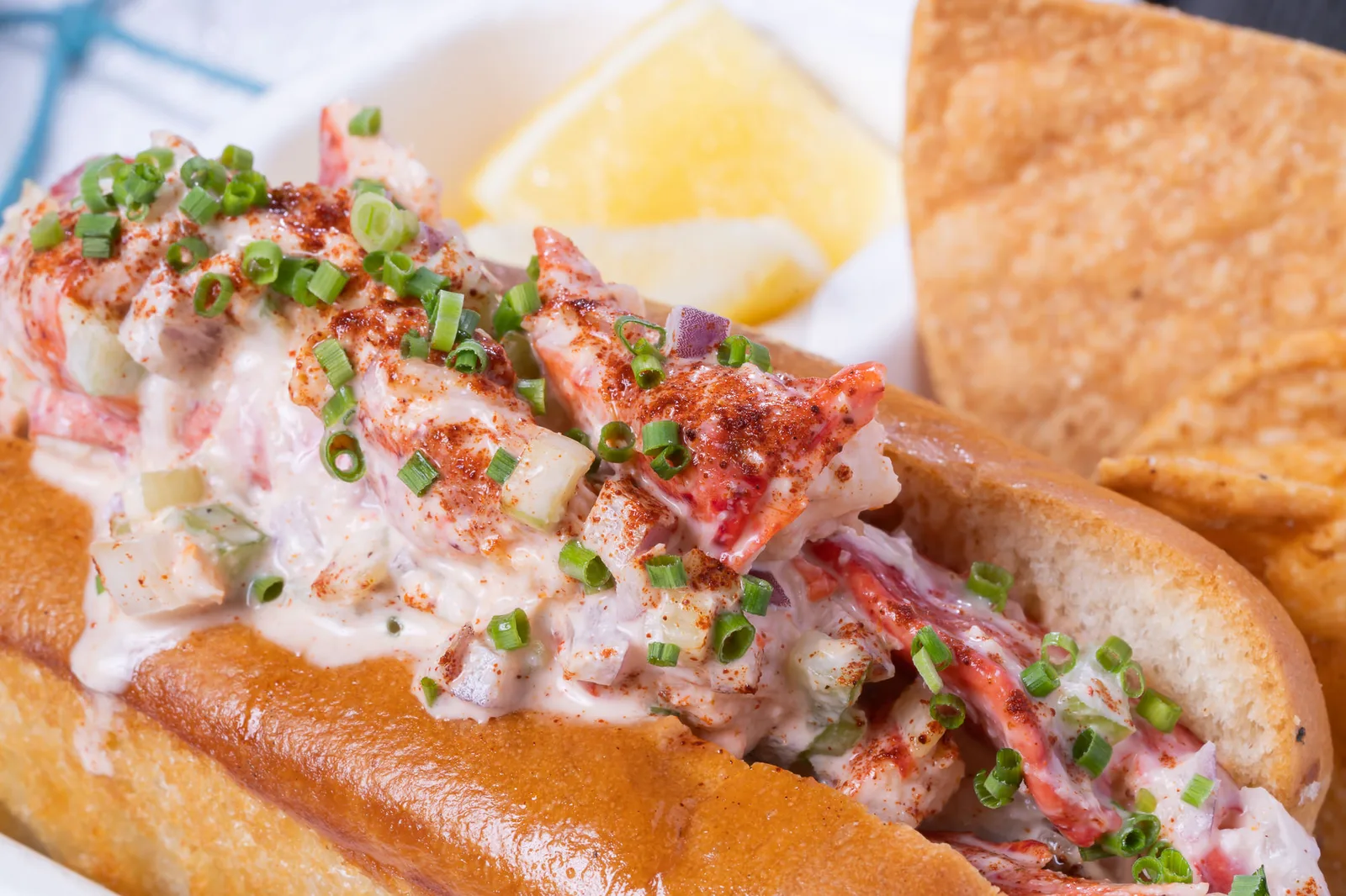 The Lazy Oyster lobster roll loaded with fresh lobster, green onion and seasoning