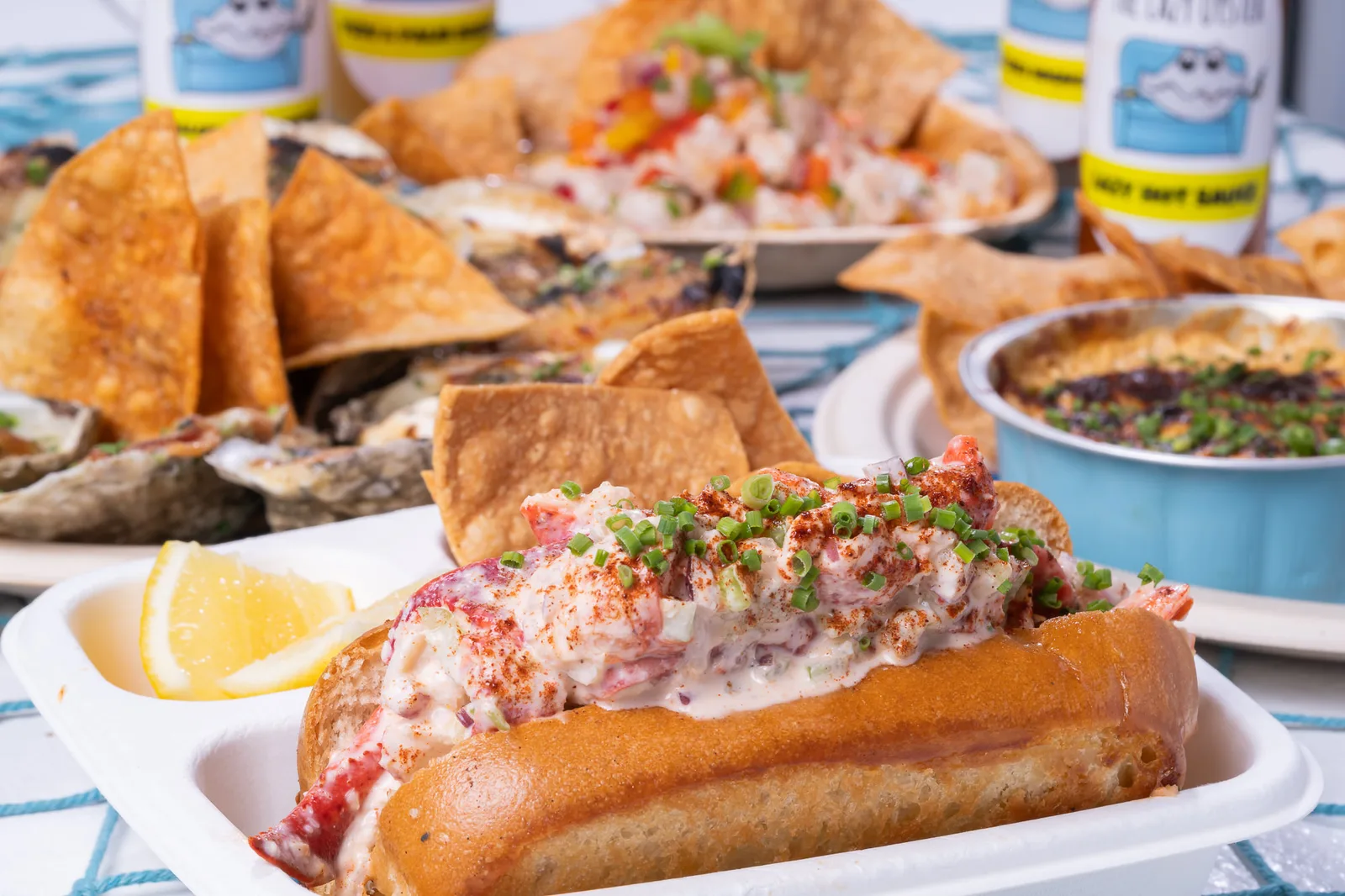 Miami lobster rolls, oysters, and chargrilled oysters from The Lazy Oyster